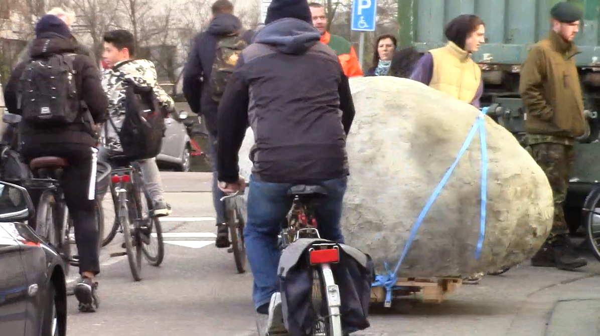 screenshot of video documentation of the tranportation of the rock